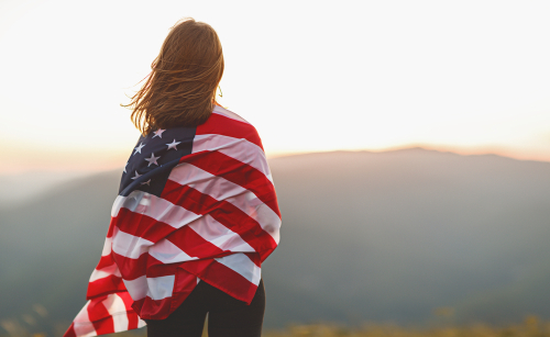 happy traveler in the united states with flag