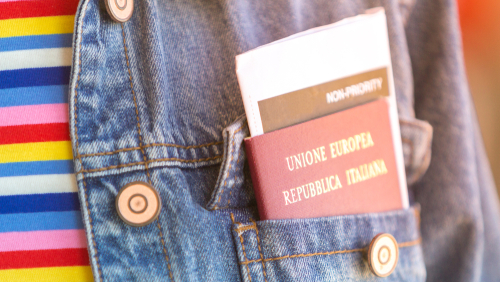 italian traveler with passport and boarding pass