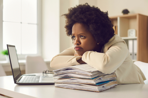 woman waiting for esta at her desk